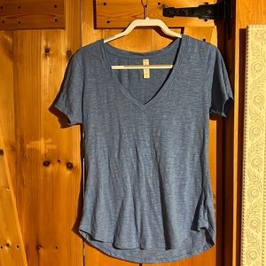 Selling a blue shirt sleeve top from altered state.